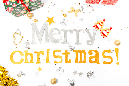 Inscription Congratulations on Merry Christmas and Happy New Year with gift boxes and Christmas toys, on a white background.の写真素材