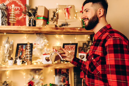 Christmas young man, in a plaid shirt, at home in a Christmas interior, Christmas, holidayの写真素材