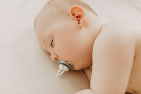 Close up portrait of beautiful sleeping baby in crib