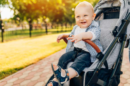 Portrait of smiling happy beautiful little kid outdoors on summer day