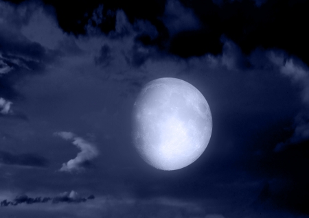 The moon in the night sky in clouds "Elements of this image furnished by NASA"の写真素材