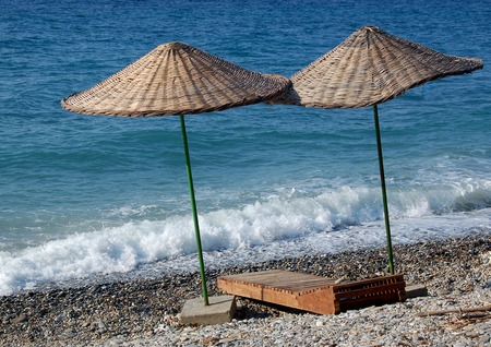 Two umbrellas  at the beachの写真素材