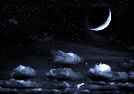The moon in the night sky in clouds Elements of this image furnished by NASAの写真素材