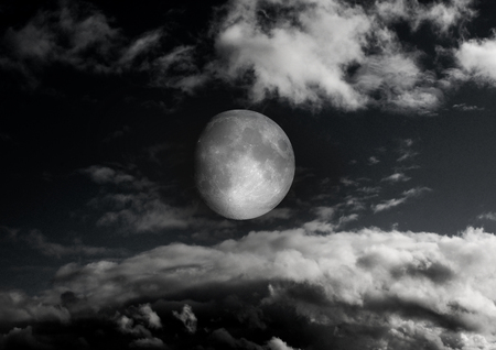 The moon in the night sky in clouds 3D illustrationの写真素材