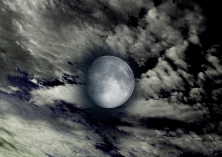 The moon in the night sky in clouds 3D illustrationの写真素材