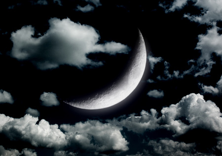 The moon in the night sky in clouds 3D illustrationの写真素材