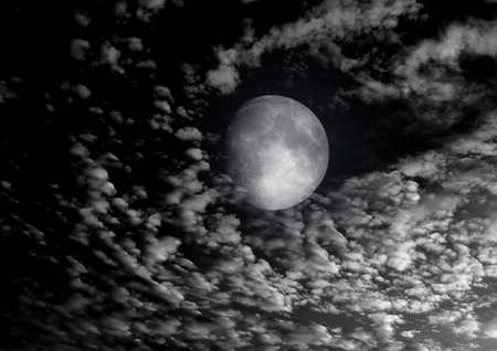 The moon in the night sky in clouds 3D illustrationの写真素材