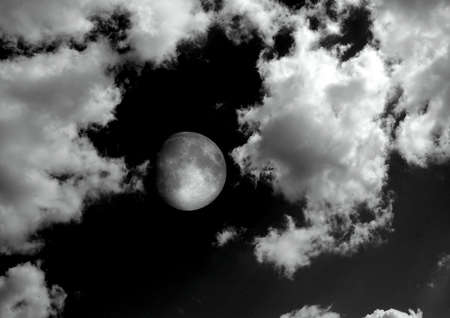 The moon in the night sky in clouds 3D illustrationの写真素材