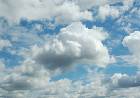 white clouds in a blue skyの写真素材