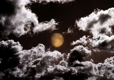 The moon in the night sky in clouds. 3D renderingの写真素材