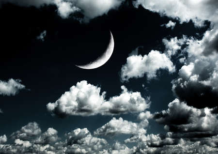 The moon in the night sky in clouds 3D illustrationの写真素材