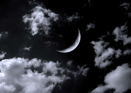 The moon in the night sky in clouds 3D illustrationの写真素材