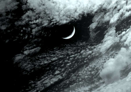 The moon in the night sky in clouds 3D illustrationの写真素材