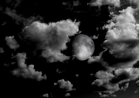 The moon in the night sky in clouds 3D illustrationの写真素材