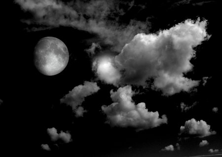 The moon in the night sky in clouds 3D illustrationの写真素材
