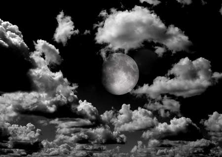The moon in the night sky in clouds 3D illustrationの写真素材