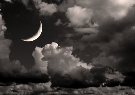 The moon in the night sky in clouds 3D illustrationの写真素材