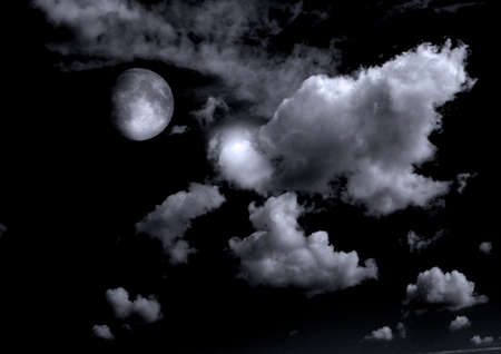 The moon in the night sky in clouds 3D illustrationの写真素材