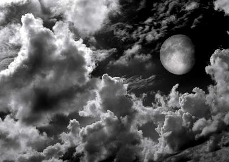 The moon in the night sky in clouds 3D illustrationの写真素材