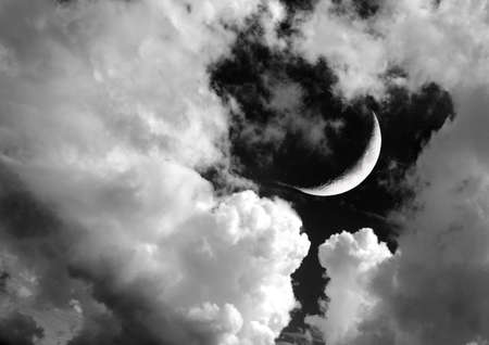 The moon in the night sky in clouds 3D illustrationの写真素材