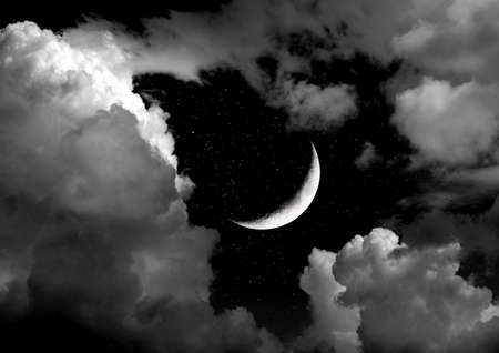 The moon in the night sky in clouds 3D illustrationの写真素材