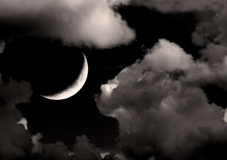 The moon in the night sky in clouds 3D illustrationの写真素材