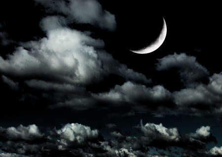 The moon in the night sky in clouds 3D illustrationの写真素材