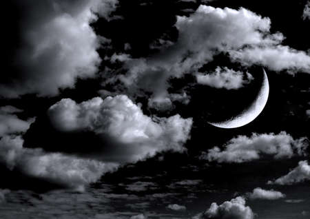 The moon in the night sky in clouds 3D illustrationの写真素材