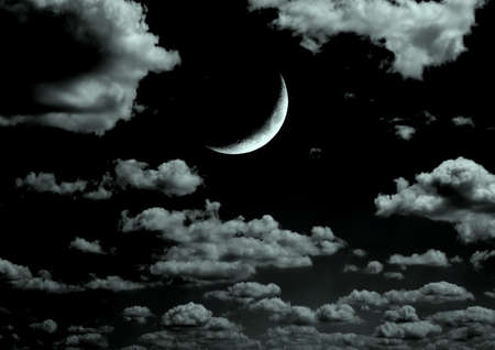 The moon in the night sky in clouds 3D illustrationの写真素材