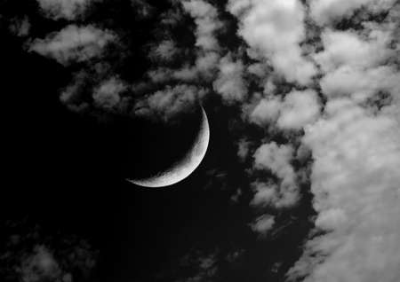 The moon in the night sky in clouds 3D illustrationの写真素材