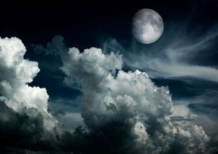 The moon in the night sky in clouds 3D illustrationの写真素材