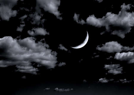 The moon in the night sky in clouds 3D illustrationの写真素材
