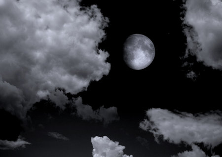 The moon in the night sky in clouds 3D illustrationの写真素材