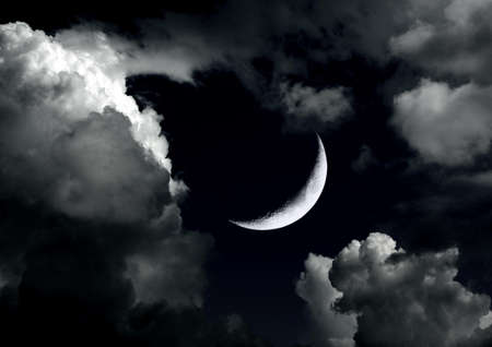 The moon in the night sky in clouds 3D illustrationの写真素材