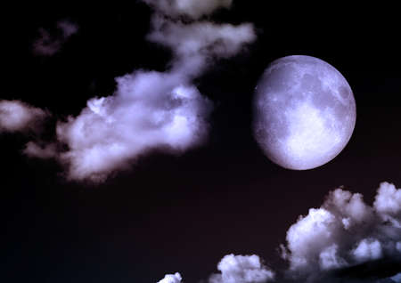 The moon in the night sky in clouds 3D illustrationの写真素材