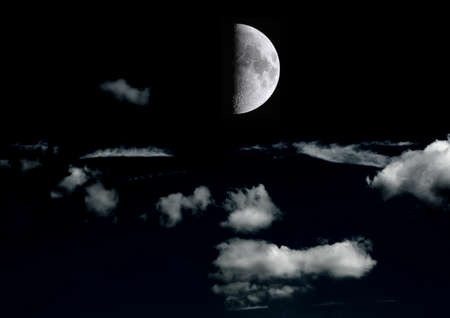 The moon in the night sky in clouds 3D illustrationの写真素材