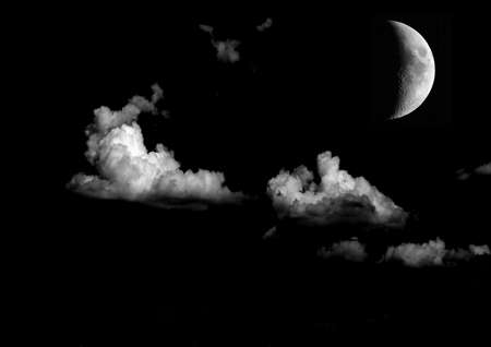 The moon in the night sky in clouds 3D illustrationの写真素材