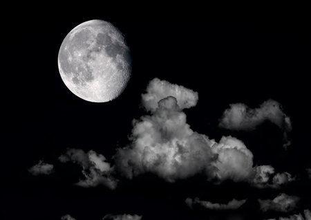 The moon in the night sky in clouds 3D illustrationの写真素材