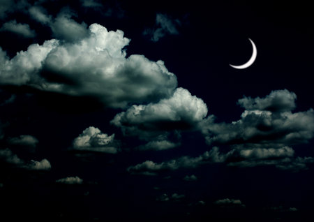 The moon in the night sky in clouds 3D illustrationの写真素材