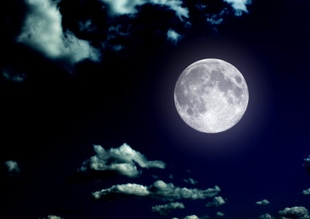 The moon in the night sky in clouds 3D illustrationの写真素材
