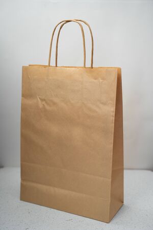 paper bag on a light background with handlesの写真素材