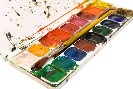 A used watercolors palet isolated on whiteの写真素材