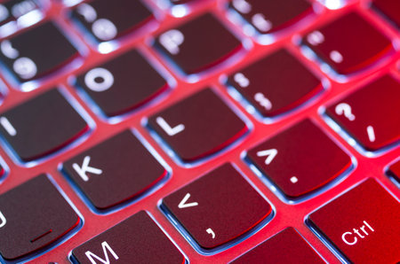 Laptop keyboard illuminated by a nice red lightの写真素材