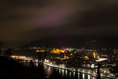 view of the old city of heidelberg with colorful christmas market and reflection in the cloudsの写真素材