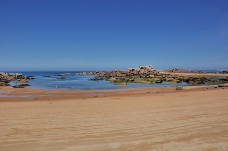 sandy cove at low tideの写真素材