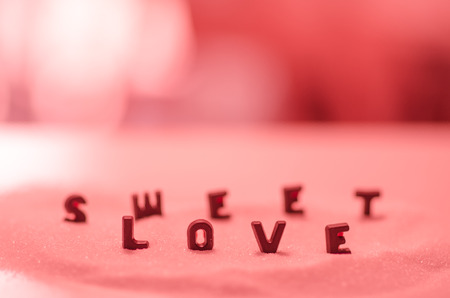 the inscription of chocolate - sweet love )on pink background)の写真素材