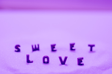 the inscription of chocolate - sweet love )on violet background)の写真素材