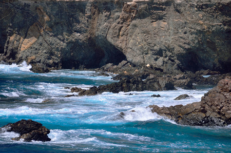 ocean and rock cost with caves of island Fuerteventura