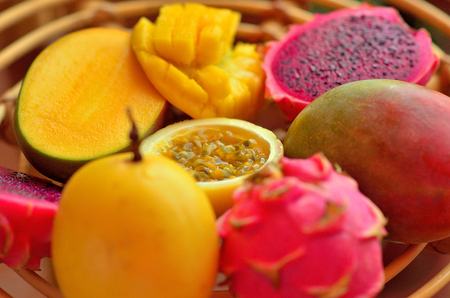 exotic fruits: mango, passion fruit, dragon fruit on the table. still life.の写真素材
