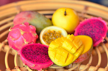 exotic fruits: mango, passion fruit, dragon fruit on the table. still life.の写真素材